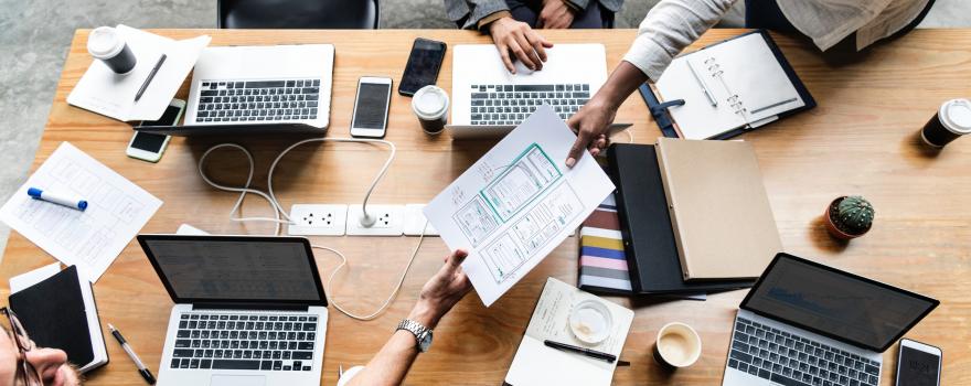 People working together at a large desk